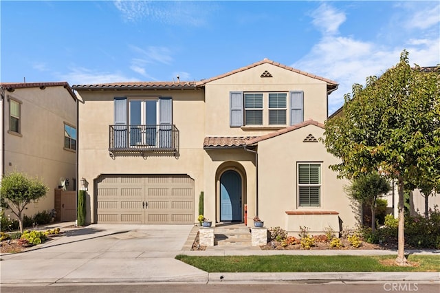 mediterranean / spanish-style house featuring a garage