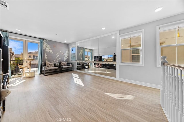 unfurnished living room with light hardwood / wood-style floors