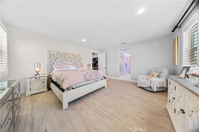 bedroom featuring light wood-type flooring