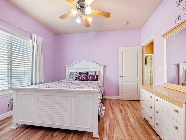 bedroom featuring ceiling fan and light wood-type flooring