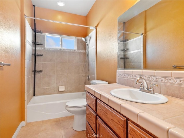 full bathroom featuring tiled shower / bath, tasteful backsplash, vanity, toilet, and tile patterned floors