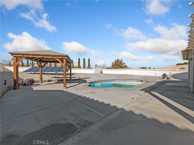 view of swimming pool featuring a gazebo and a patio area