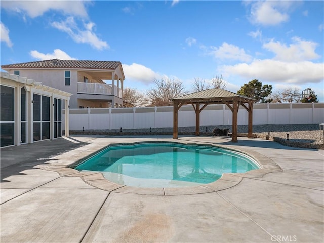 view of swimming pool featuring a gazebo and a patio area