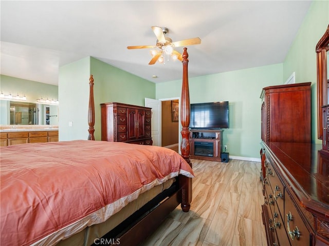 bedroom with light hardwood / wood-style flooring and ceiling fan