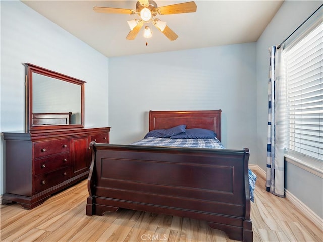 bedroom featuring light hardwood / wood-style flooring and ceiling fan