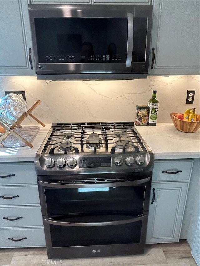 interior details featuring stainless steel appliances and backsplash