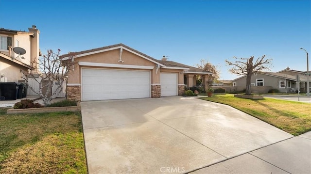 view of front of house with a garage and a front yard