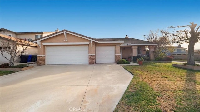 view of front facade featuring a garage and a front lawn