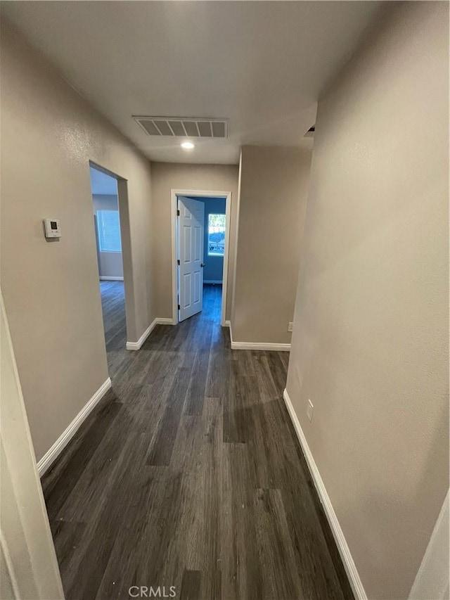 hall with dark hardwood / wood-style floors