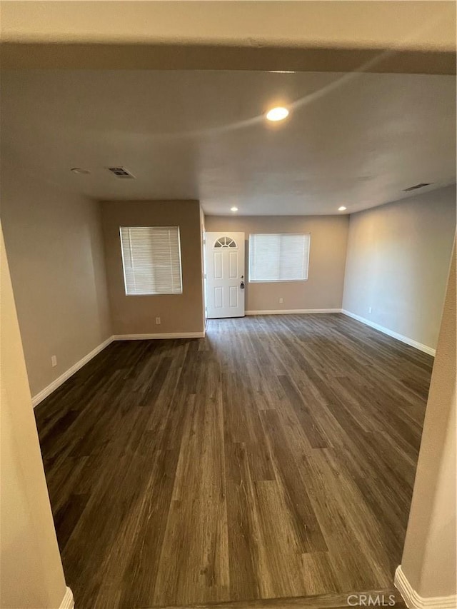 interior space with dark hardwood / wood-style flooring