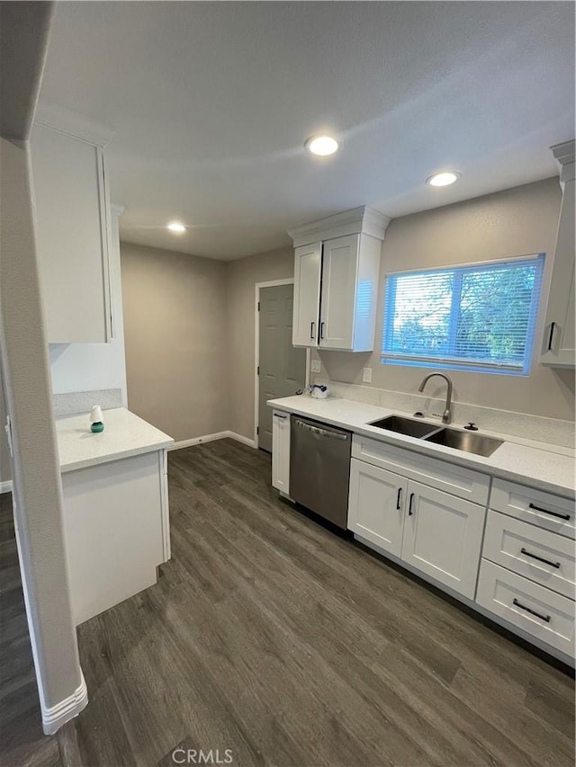 kitchen featuring dark hardwood / wood-style flooring, sink, white cabinets, and dishwasher