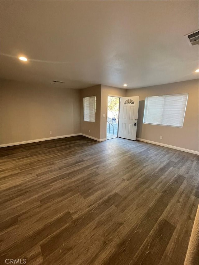 interior space with dark hardwood / wood-style floors