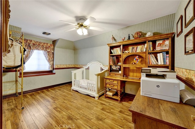 office space with ceiling fan and light wood-type flooring