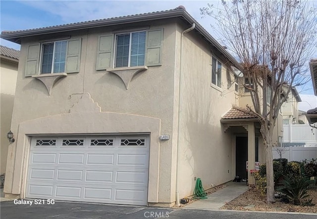 view of front of home with a garage