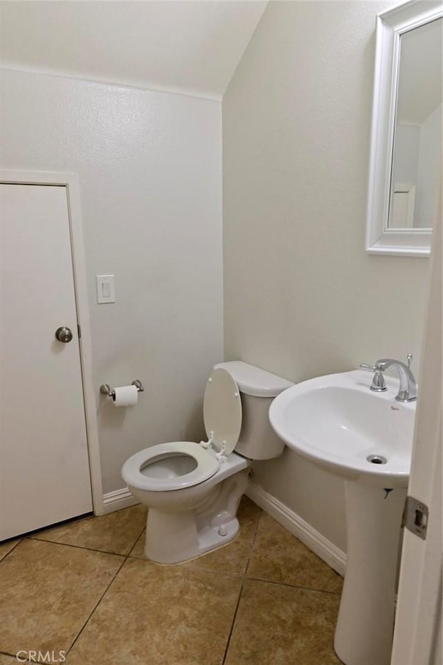 bathroom with tile patterned floors and toilet