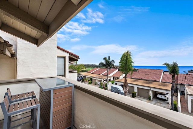 balcony featuring a water view