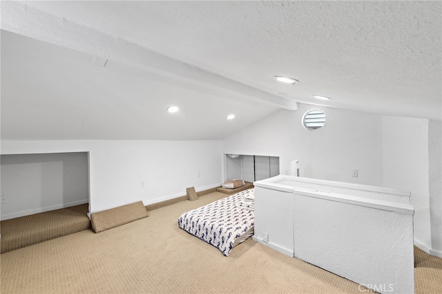 interior space featuring lofted ceiling with beams, a textured ceiling, and carpet