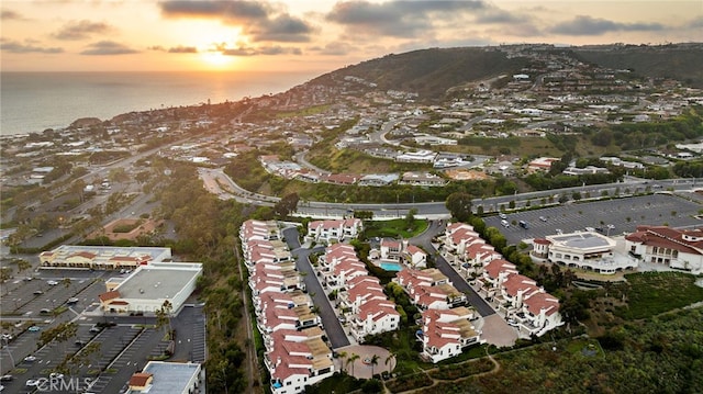 aerial view at dusk with a water view