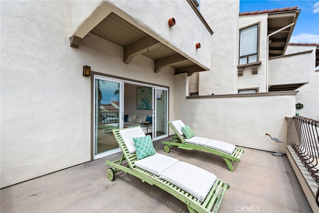 view of patio with a balcony