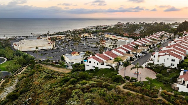 aerial view at dusk with a water view