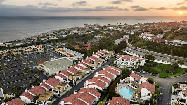 aerial view at dusk with a water view