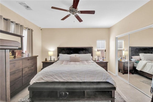 carpeted bedroom featuring ceiling fan