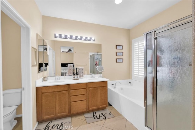 full bathroom featuring ceiling fan, tile patterned flooring, vanity, independent shower and bath, and toilet