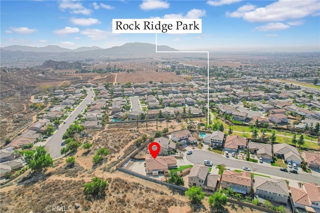 birds eye view of property featuring a mountain view