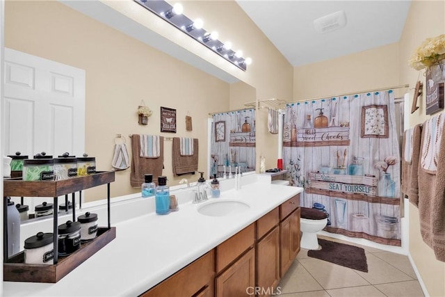 full bathroom with shower / tub combo with curtain, tile patterned floors, toilet, and vanity