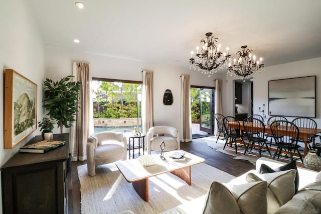 living room with a chandelier and hardwood / wood-style floors