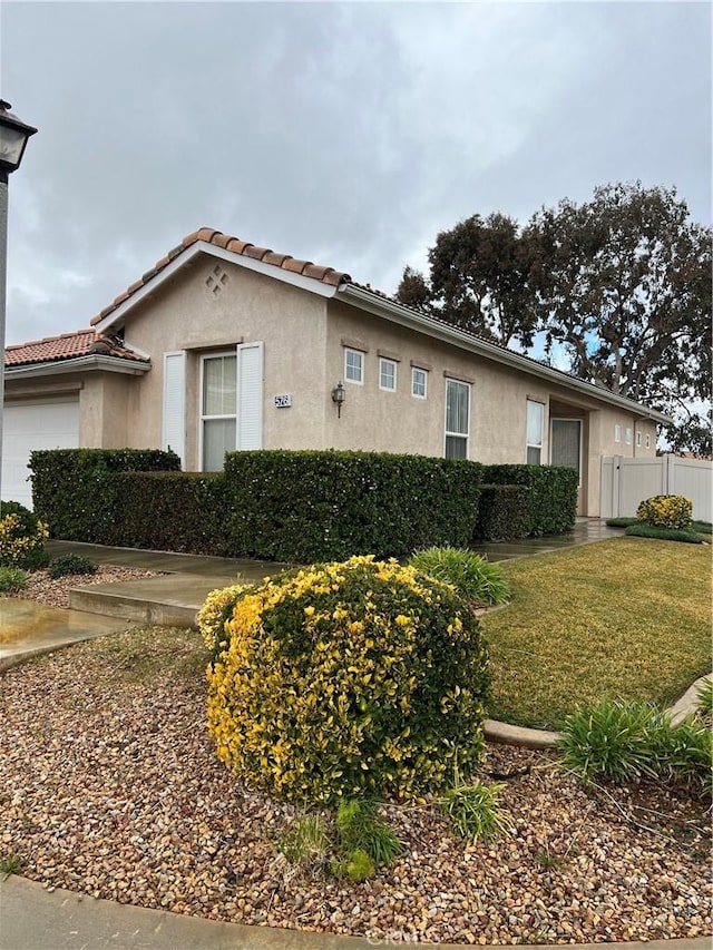 view of side of property featuring a yard