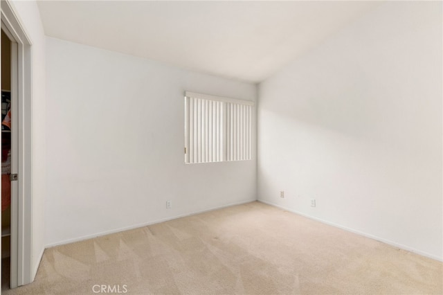 empty room featuring light colored carpet