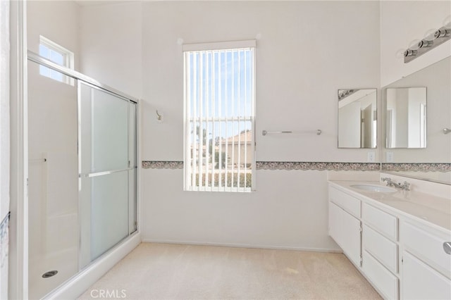 bathroom with vanity and an enclosed shower