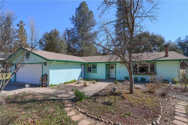 ranch-style house featuring driveway and a garage