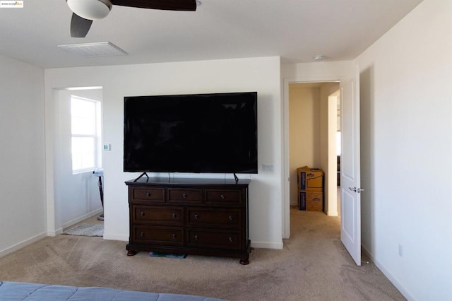 living room featuring ceiling fan and light colored carpet