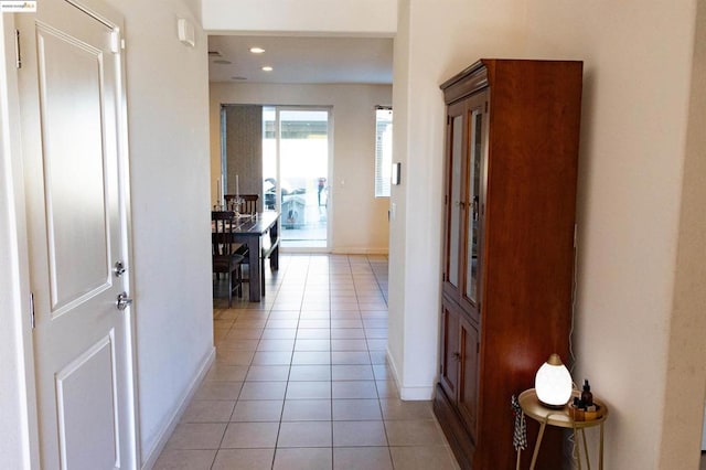 hallway featuring light tile patterned flooring