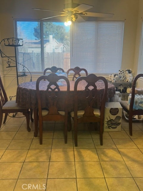 tiled dining room with ceiling fan