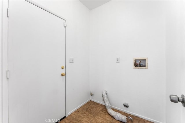 clothes washing area with washer hookup, laundry area, and baseboards