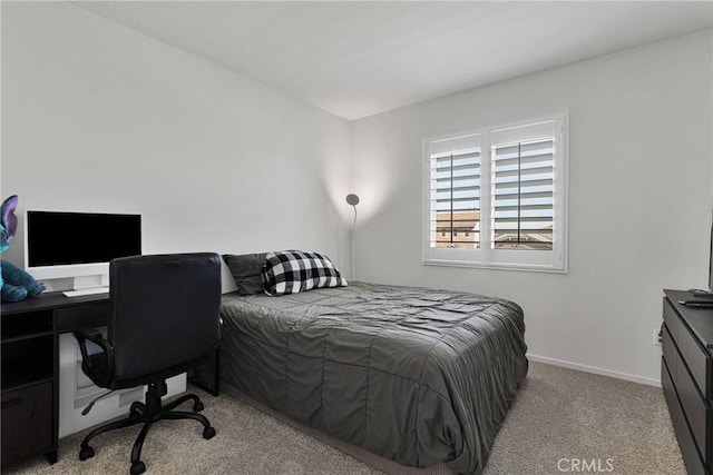 bedroom featuring light carpet