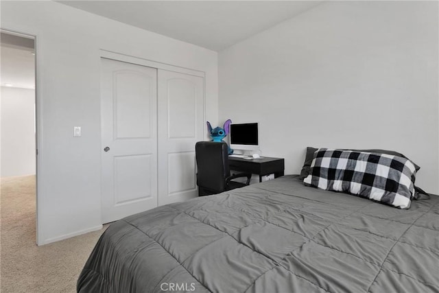 carpeted bedroom with a closet