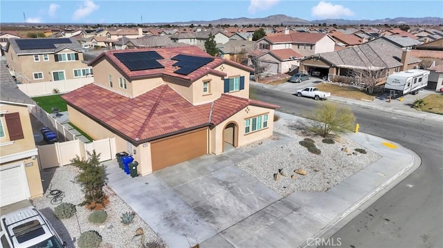 birds eye view of property with a mountain view