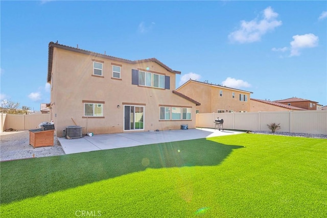 back of property featuring a yard, central AC unit, and a patio