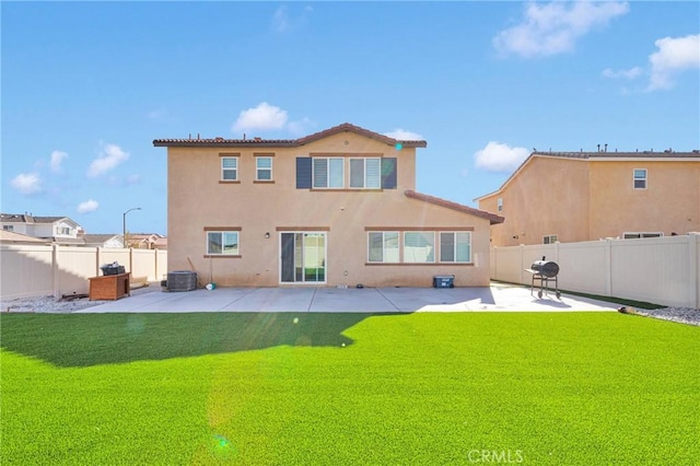 back of property featuring central AC unit, a lawn, and a patio