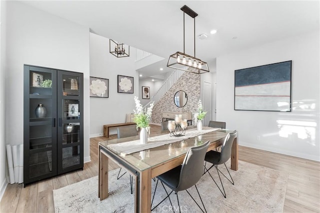 dining room featuring a chandelier and light hardwood / wood-style flooring