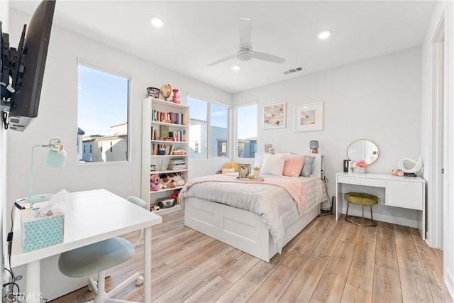 bedroom featuring light wood-type flooring and ceiling fan