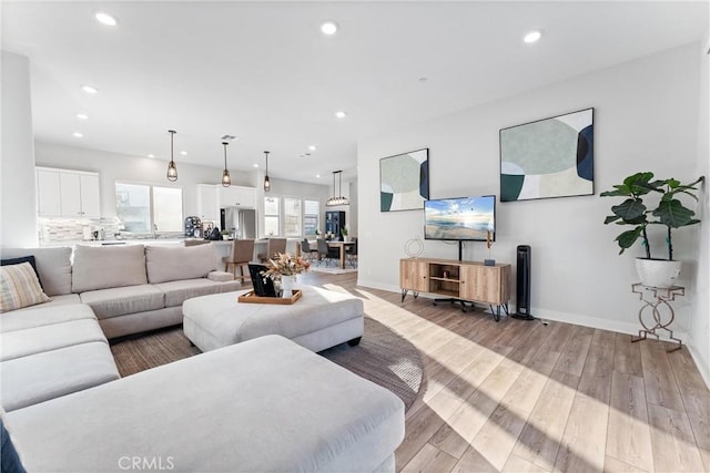 living room with light hardwood / wood-style flooring