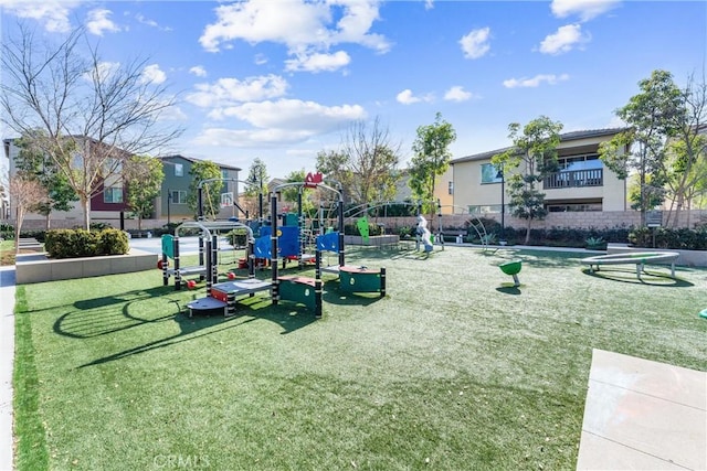 view of playground with a lawn