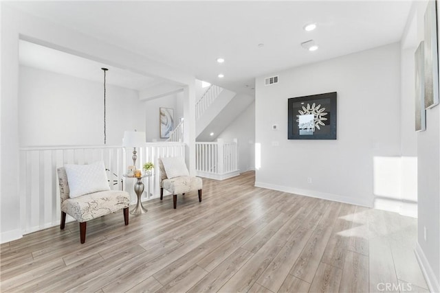 sitting room featuring light hardwood / wood-style floors