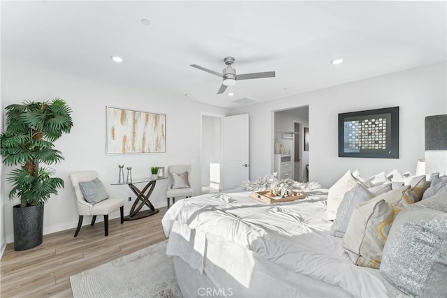 bedroom featuring ceiling fan and light hardwood / wood-style flooring