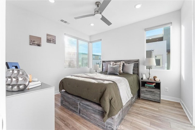 bedroom featuring ceiling fan and light hardwood / wood-style floors